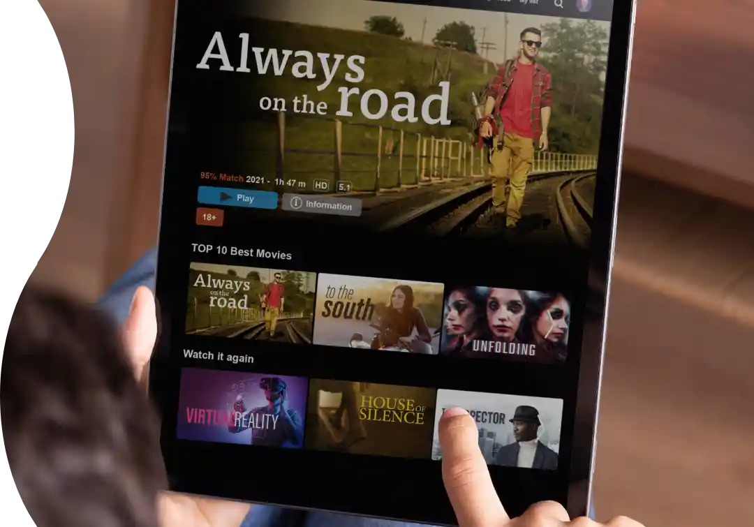 Enjoying Ultranet's high-speed internet, a person seamlessly streams top-rated movies on a tablet, experiencing smooth and uninterrupted entertainment.